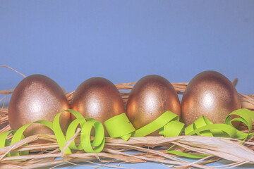 easter eggs in a basket. easter eggs. painted golden eggs. eggs for easter. the holiday table.