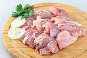 raw chicken goulash on white background