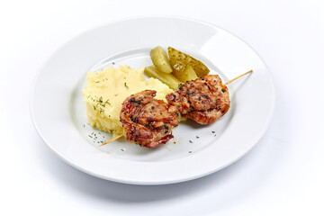 pork kebab with mashed potato and vegetables