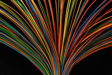 Colored electrical cable wire on black background