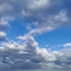 clear blue sky with rain clouds