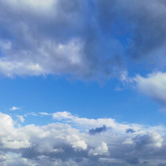 clear blue sky with rain clouds