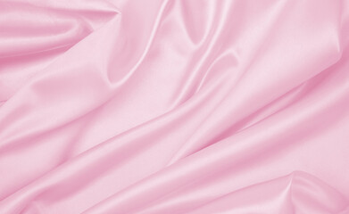 Smooth elegant pink silk or satin texture as wedding background. Luxurious background design
