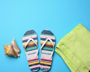 rubber womens striped slippers on a blue background