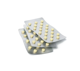 two packs of round pills in blister pack isolated on white background