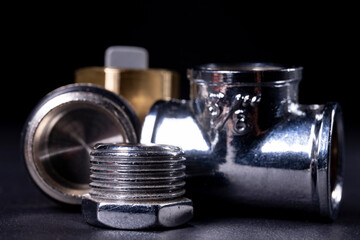 Metal plumbing fittings used to repair the water system. Accessories and spare parts for mechanics.