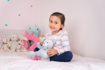 Cute toddler girl in her room.