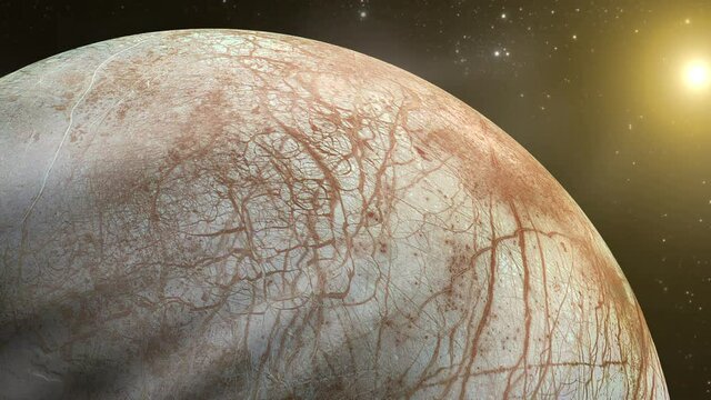 Jupiter Moon Europa Silhouette Against Bright Sun in Deep Space - Elements of this Video Furnished by NASA