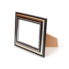 Wooden frame for paintings, mirrors or photo in perspective view isolated on white background. Design element with clipping path