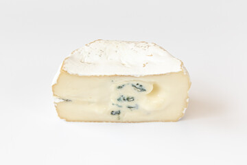 Camembert or brie cheese isolated on white background. Soft cheese covered with edible white mold view from above. Gourmet blue cheese.
