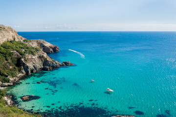 View of the rocky coast of the sea, the lagoon of the beautiful turquoise clear water and the...
