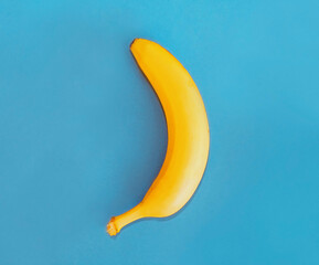Close up yellow banana on a blue background