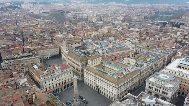 Aerial view of downtown Rome, Italy. City center with government buildings seen from drone flying in sky and Saint Peter's Basilica in Vatican City in background. Italian panoramic urban landscape