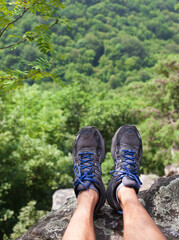 Hiker relaxing feet looking at view. 