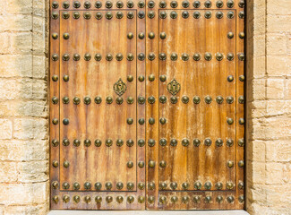 Beautiful wooden gate of a church in Vejer de la Frontera, Cadiz. Andalusia, Spain
