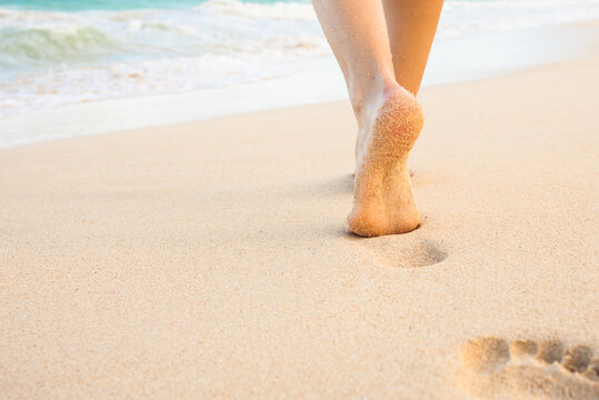 feet walking on the beach