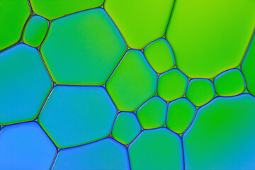 Bright Background Closeup of Asymmetric Oil Drops in Liquid. Creative Macro Photo of Water Surface...