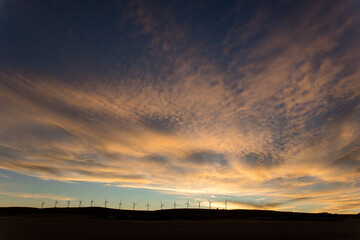 Sunset on the prairies with windmills