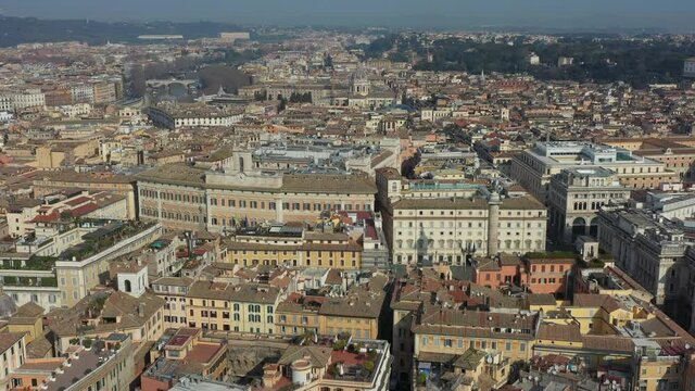 Aerial view of downtown Rome, Italy. City center with Italian government buildings in Piazza Colonna seen from drone flying in sky: Palazzo Chigi and Parlamento at Palazzo Montecitorio
