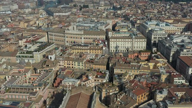 Aerial view of downtown Rome, Italy. City center with Italian government buildings seen from drone flying in the sky: Chigi Palace (Prime Minister) and Chamber of Deputies (Parliament)
