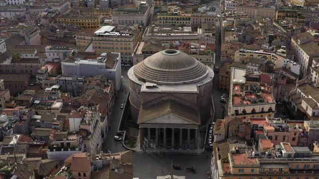 Aerial view of the Pantheon, famous landmark in Rome, Italy. Former Roman temple and now Catholich church in Roma, Italia seen from drone flying in sky. Building and tourist attraction of Italian city