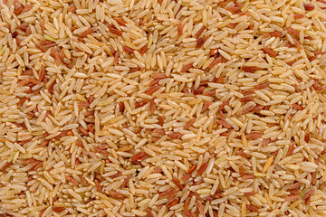 Full frame of brown rice and red rice.