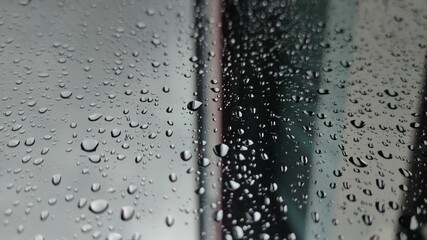 Rain drops on the window glass background. Abstract water drops background