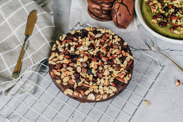 Chocolate brownie topping with almond. Fresh homemade bakery. Served cakes. Top view. Free space for text.