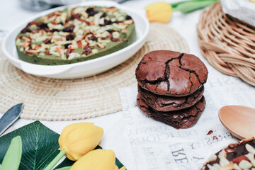 Chocolate brownie cookies. Baked Creamy Dark chocolate chip cookies on dark texture background. Morning table. Copy space.