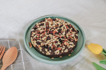 Chocolate brownie topping with almond. Fresh homemade bakery. Served cakes. Top view. Free space for text.