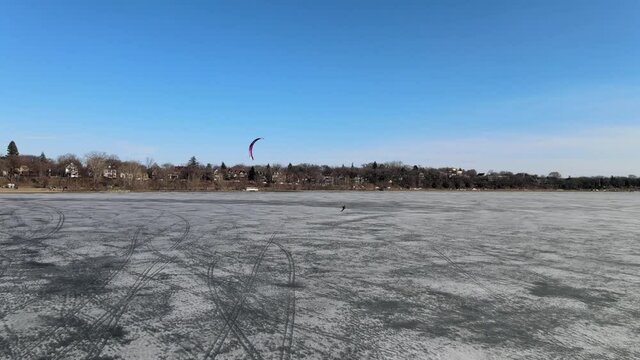 wind surfing over a frozen lake, winter sports in Minnesota, explore only in MN, meet minneapolis msp