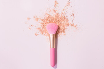 Make up brushes with powder on white background