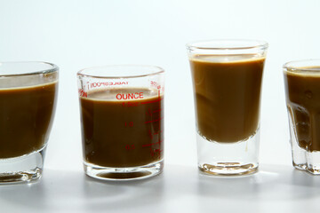 Milk coffee in transparent glass