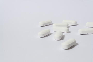 group of messy pills on white background