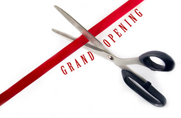 Scissors cutting red ribbon Isolated on white background. opening ceremony concept