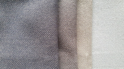 close up of soft fabric catalog in light brown color tone. a selection of fabric samples for...