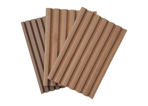 stack of wooden corrugated panel samples showing multi pattern of material profiles isolated on white background with clipping path. interior wall finishing materials  with cut and craft technique.
