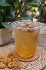 Cold dried longan water, golden color is a Thai herbal drink to quench your thirst, exhort heat add freshness, good for the body.