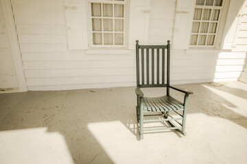 Single empty rocking chair on porch with copy space. 
