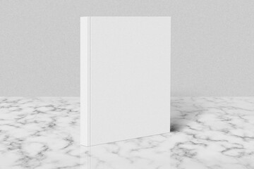 Magazine or catalog standing on white marble table.