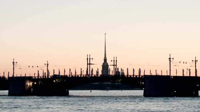 Silhouette of Chapel of Peter and Paul fortress and the Palace Bridge early morning - St. Petersburg, Russia