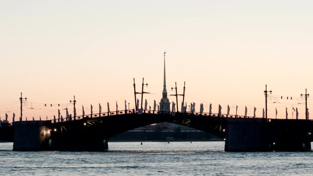 TIME-LAPSE: Opening Palace Bridge and Chapel of Peter and Paul fortress early morning - St. Petersburg, Russia