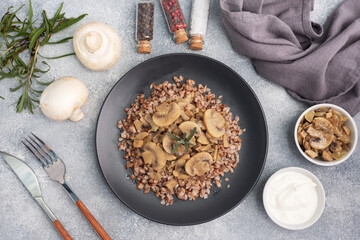 Boiled buckwheat with stewed mushrooms. Russian traditional food. Healthy diet food. copy space, top view.