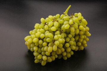 Green grape branch over background