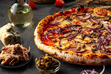Fresh baked onion neopolitan pizza on the decorated grey background