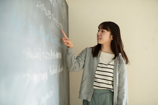 Young Female Teacher at Platform