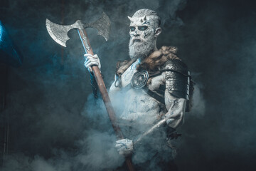 Nordic warlike undead with hatchet in smokey background
