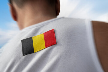 The national flag of Belgium on the athlete's back
