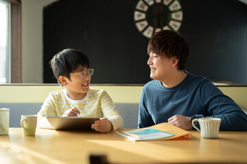 Boy and Tutor Learning with Tablet PC