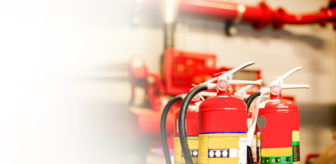 The red fire extinguisher is ready for use in case of an indoor fire emergency.	